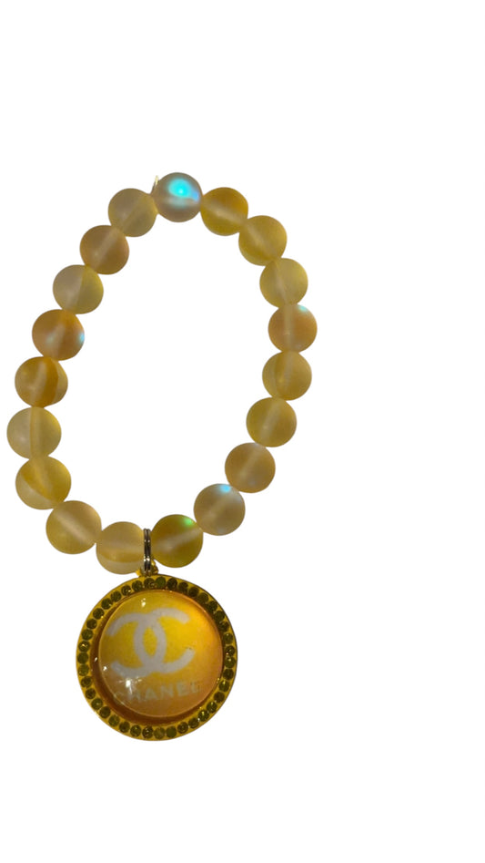 Beaded bracelet with charms